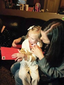 Addie opening cards with her mother, Tami