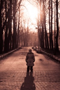 Little girl in autumn park